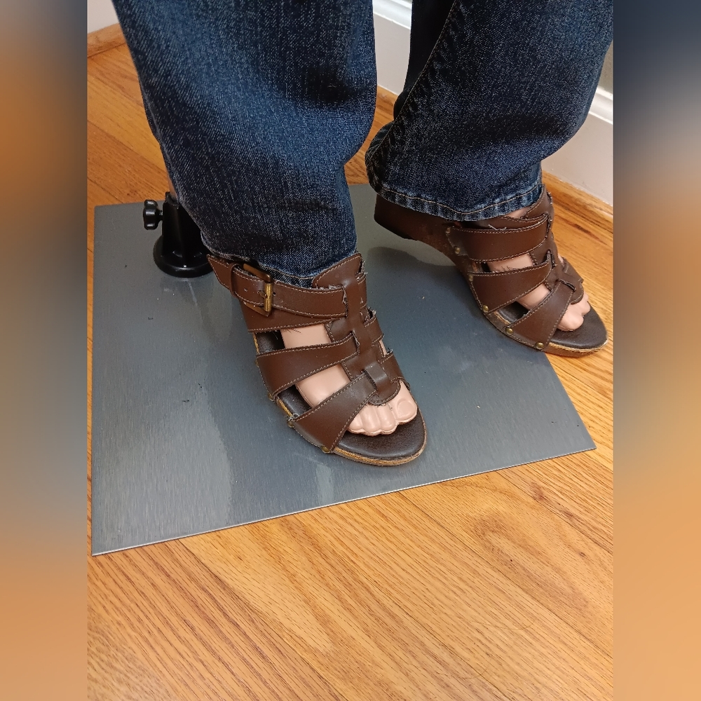 Open toed, strappy brown shoes